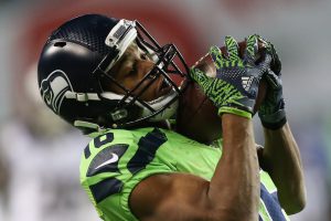 Seattle Seahawks wide receiver Tyler Lockett catches a pass from quarterback Russell Wilson for a touchdown in the second half against the Los Angeles Rams at CenturyLink Field on Thursday, Dec. 15, 2016. (GRANT HINDSLEY, seattlepi.com)
