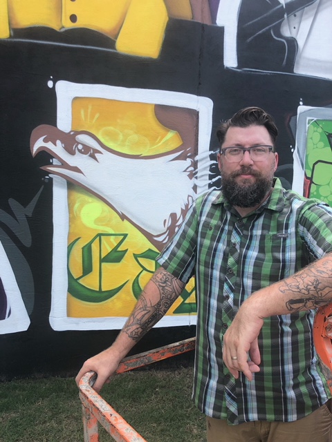 Black Wall St. artist Donald “Scribe” Ross (inset) has spent more than 100 hours, working on the 10ft by 30ft mural for the past 10 days. (Photo by Joseph Goodwin)