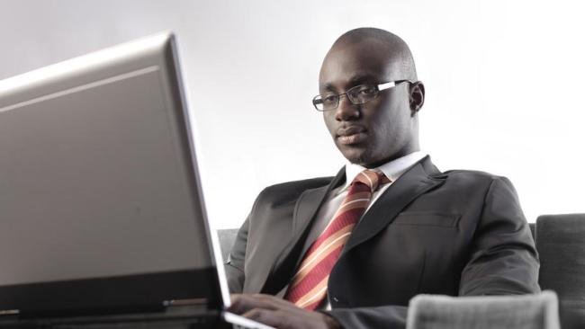 black-man-types-on-laptop_t750x550